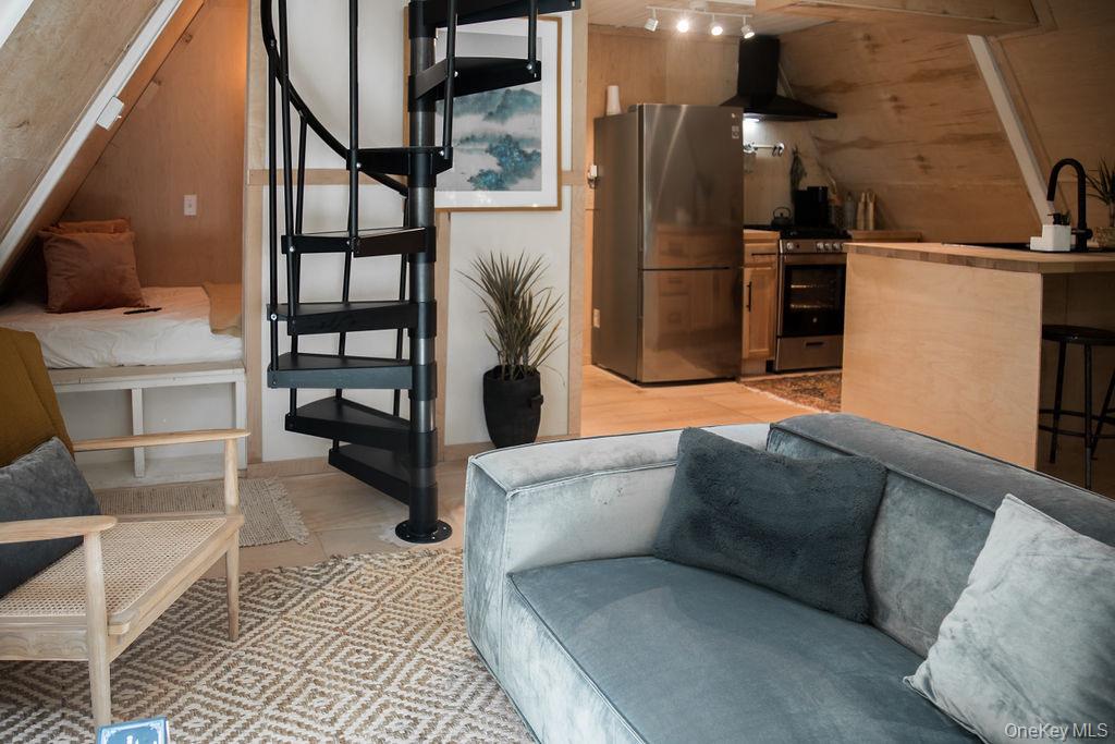 161 Pine Hill Road Shandaken, NY 12410 - Photo 8 of 39 Living room featuring wooden walls