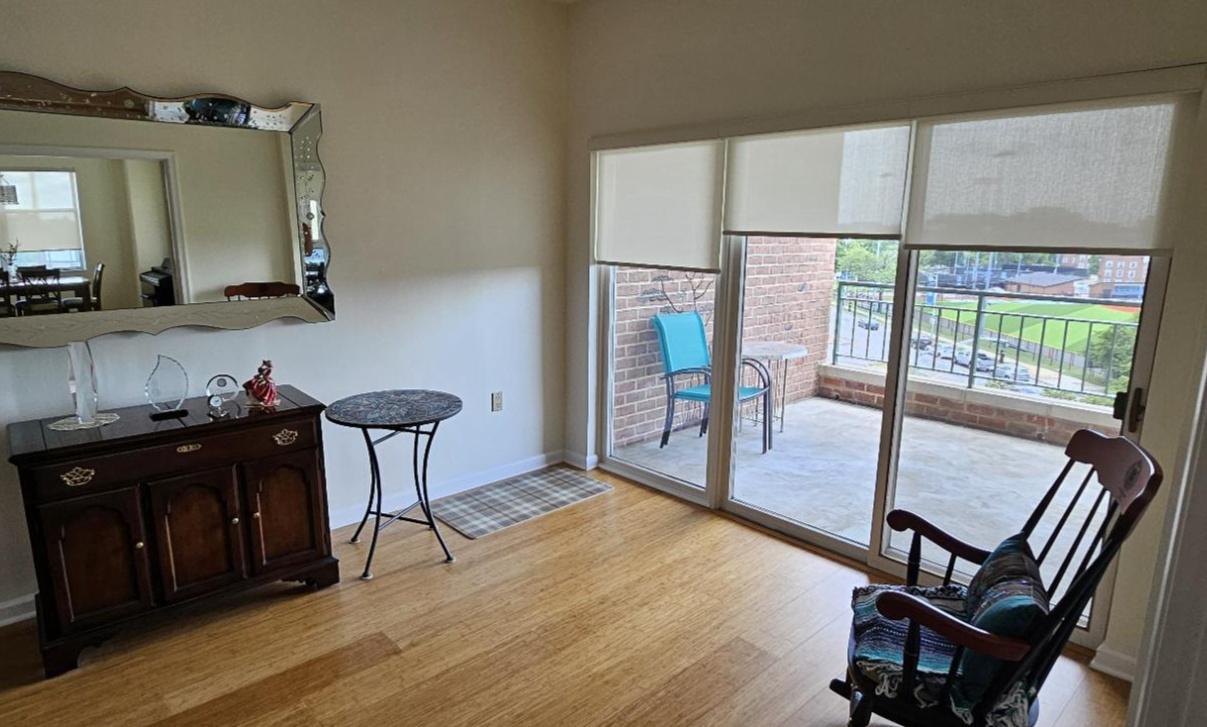 3801 Canterbury Road, Unit 409 Baltimore, MD 21218 - Photo 6 of 31 Large Den With Direct Access to Private Balcony