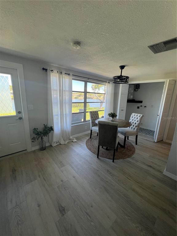 4117 Hampton Drive New Port Richey, FL 34652 - Photo 12 of 23 a living room with furniture and a wooden floor