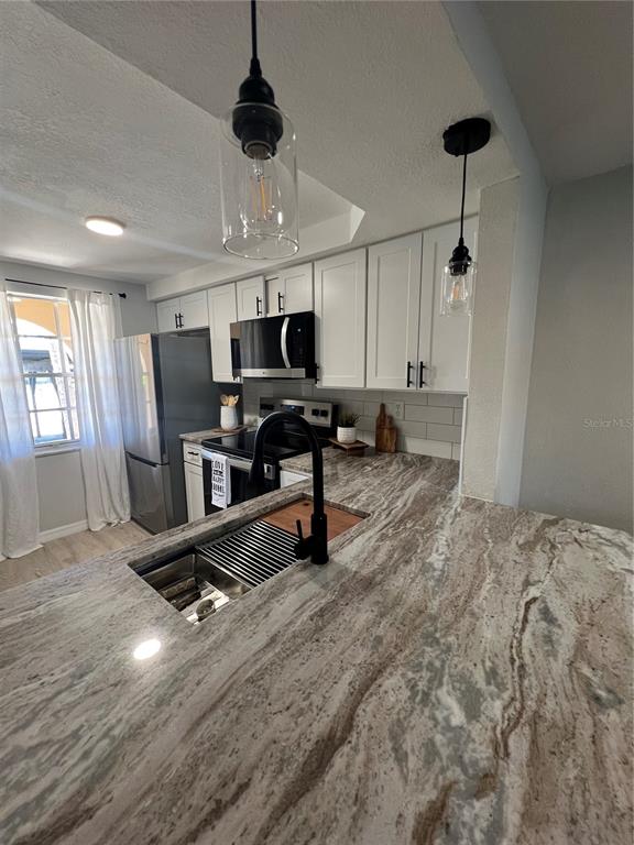 4117 Hampton Drive New Port Richey, FL 34652 - Photo 3 of 23 a view of a room with gym equipment and windows