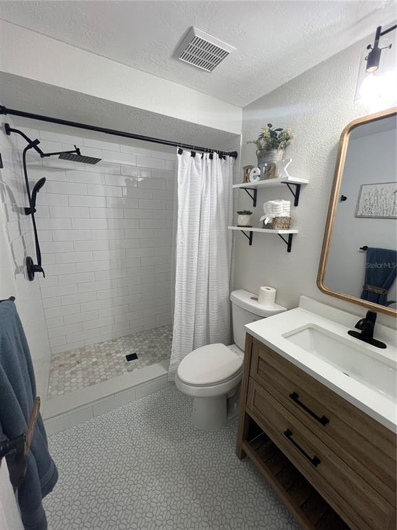 4117 Hampton Drive New Port Richey, FL 34652 - Photo 6 of 23 a bathroom with a sink toilet and shower