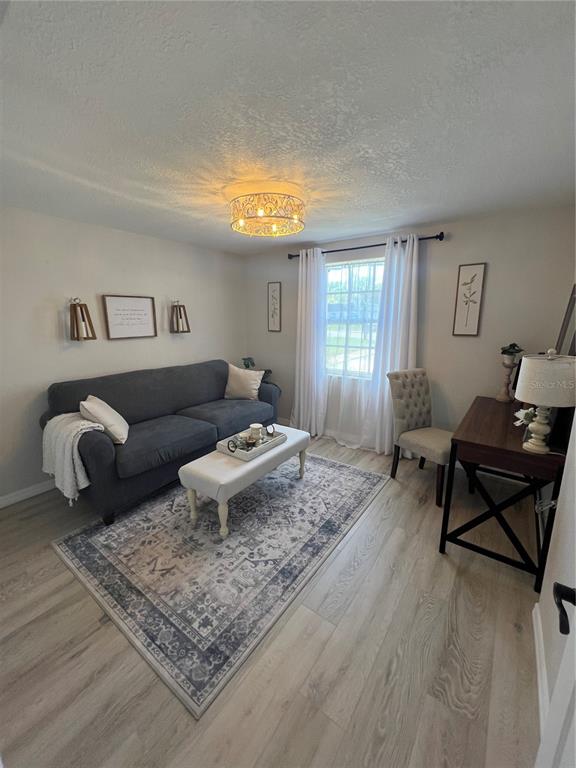 4117 Hampton Drive New Port Richey, FL 34652 - Photo 7 of 23 a living room with furniture and a rug
