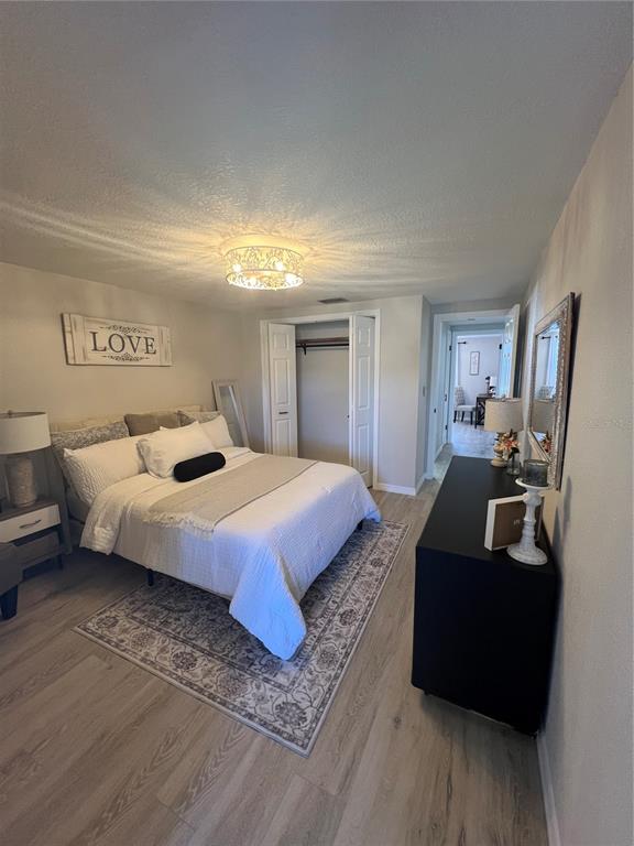 4117 Hampton Drive New Port Richey, FL 34652 - Photo 9 of 23 a bedroom with a bed a couch and dresser