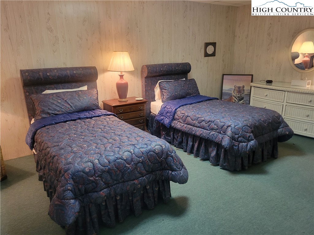 488 Meadow View Road Glade Valley, NC 28627 - Photo 22 of 32 a bedroom with two beds and painting on the wall