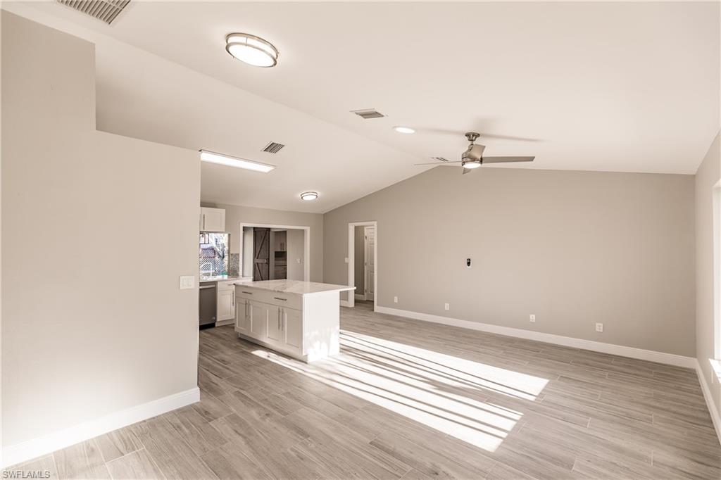 18429 Sunflower Road Fort Myers, FL 33967 - Photo 3 of 35 a view of a living room with a white cabinets