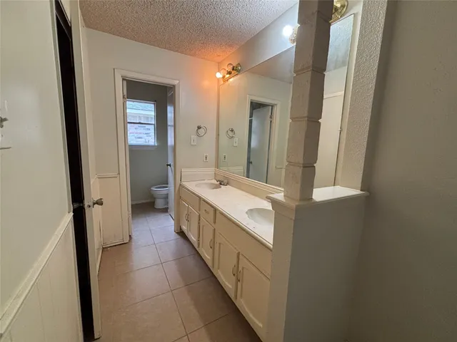 an empty room with closet area