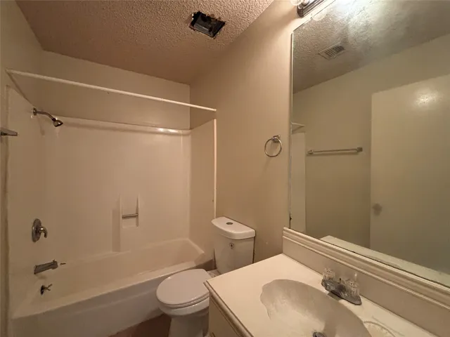 a view of a kitchen from the hallway