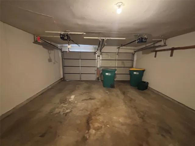 a front view of a house with a garden and yard