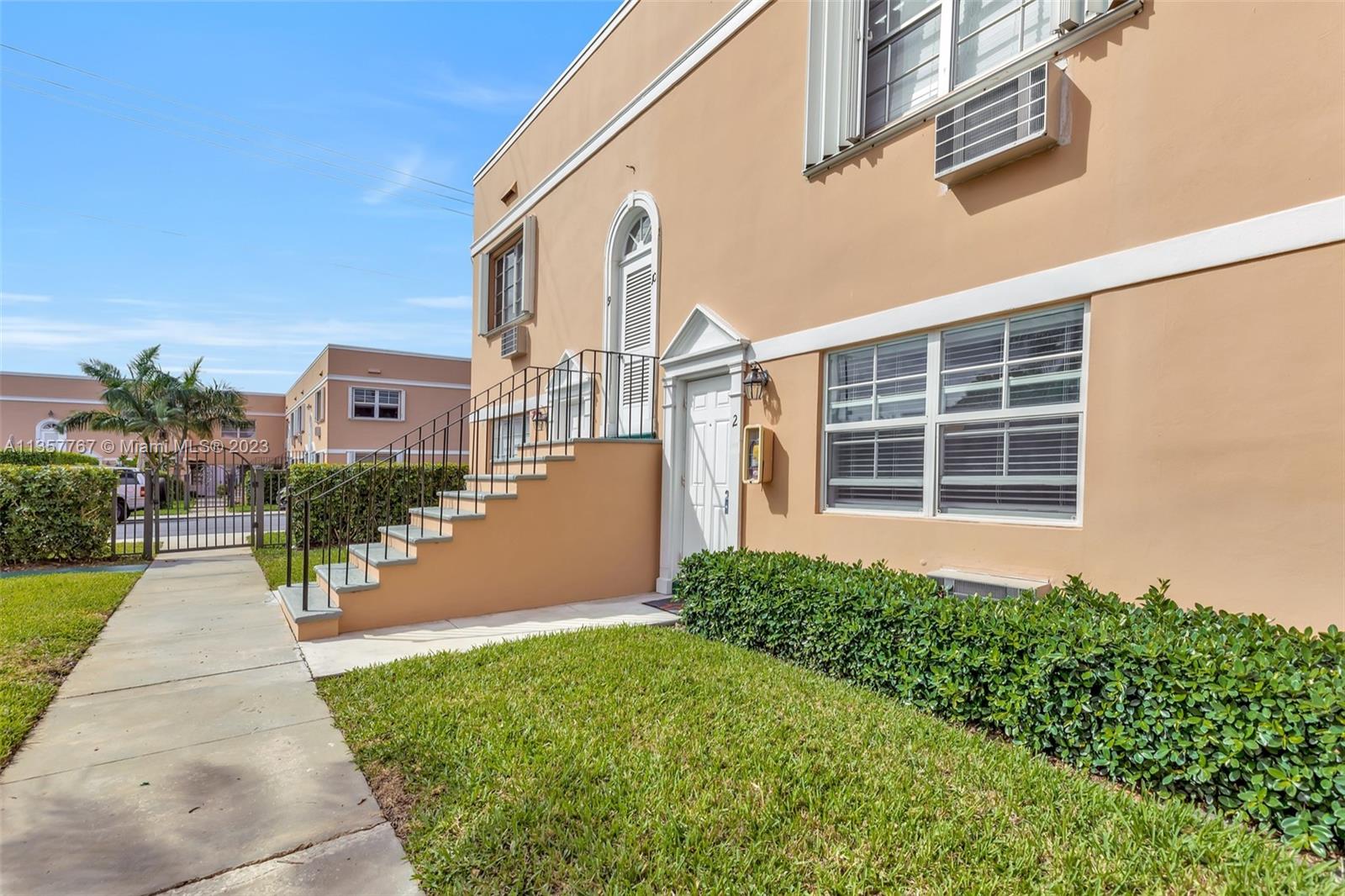 31 South Golfview Road, Unit 2 Lake Worth, FL 33460 - Photo 8 of 18 a front view of a house with a yard