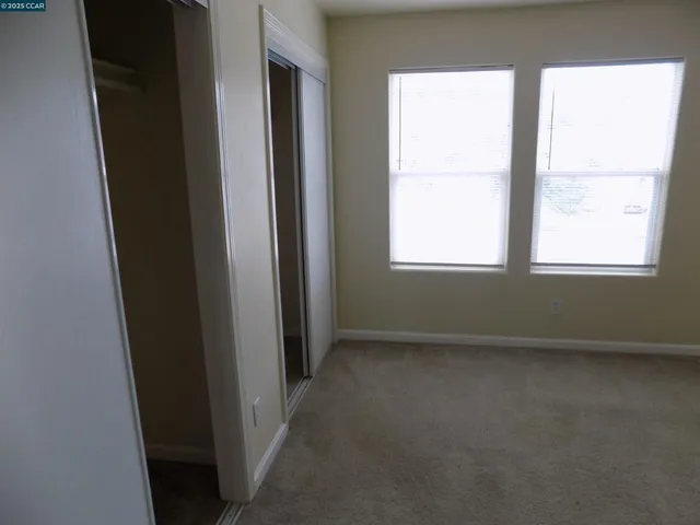 a view of hallway with closet