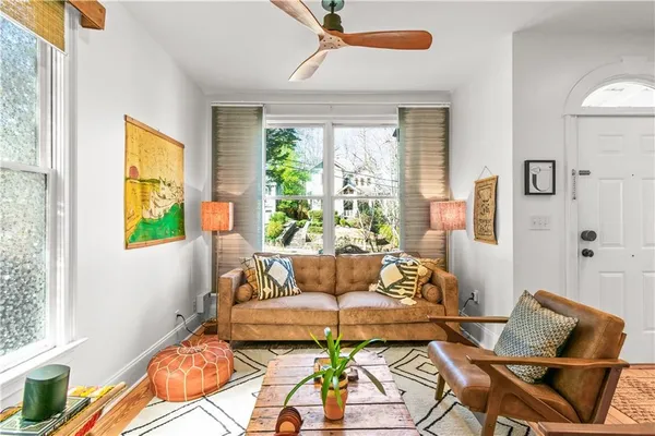 a living room with furniture and a window
