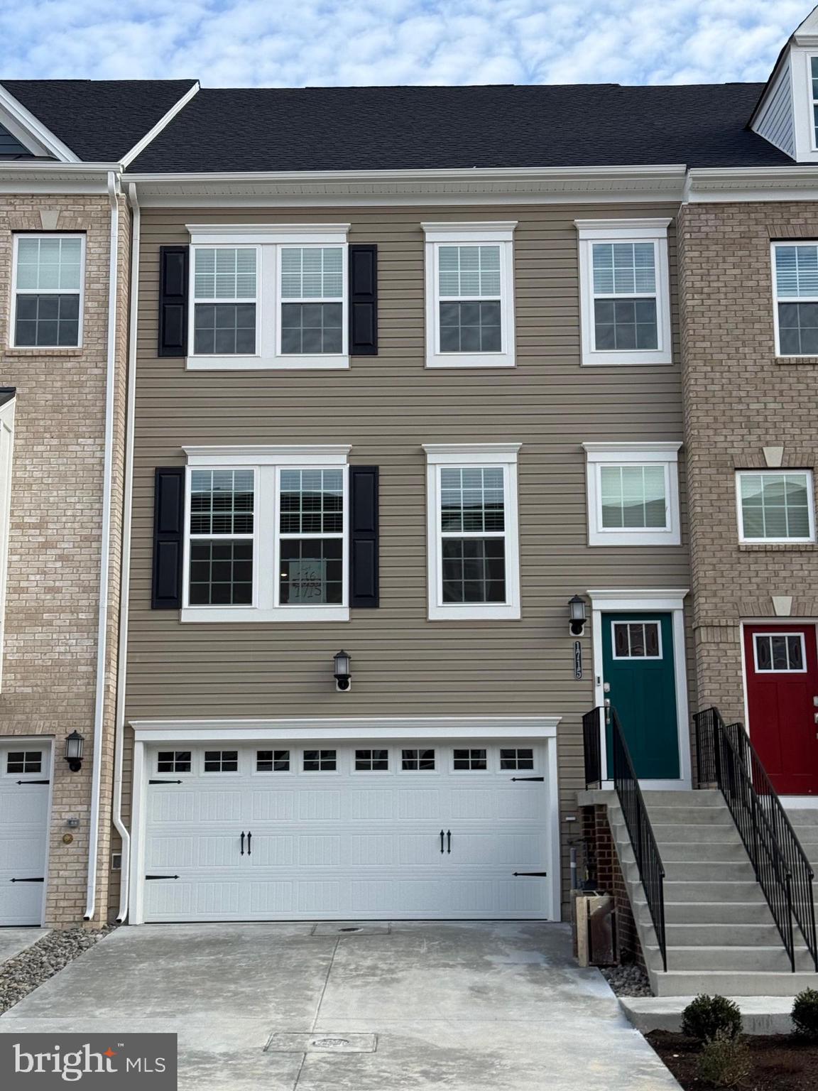1715 Water Xing Road Pikesville, MD 21208 - Photo 2 of 2 a front view of a building with a garden