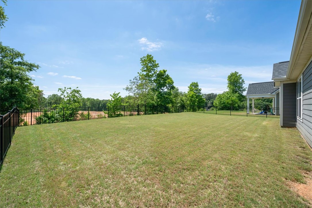 21 Barron Glenn Way Anderson, SC 29621 - Photo 43 of 48 A spacious, manicured lawn with a privacy fence for extra peace of mind for play and privacy.