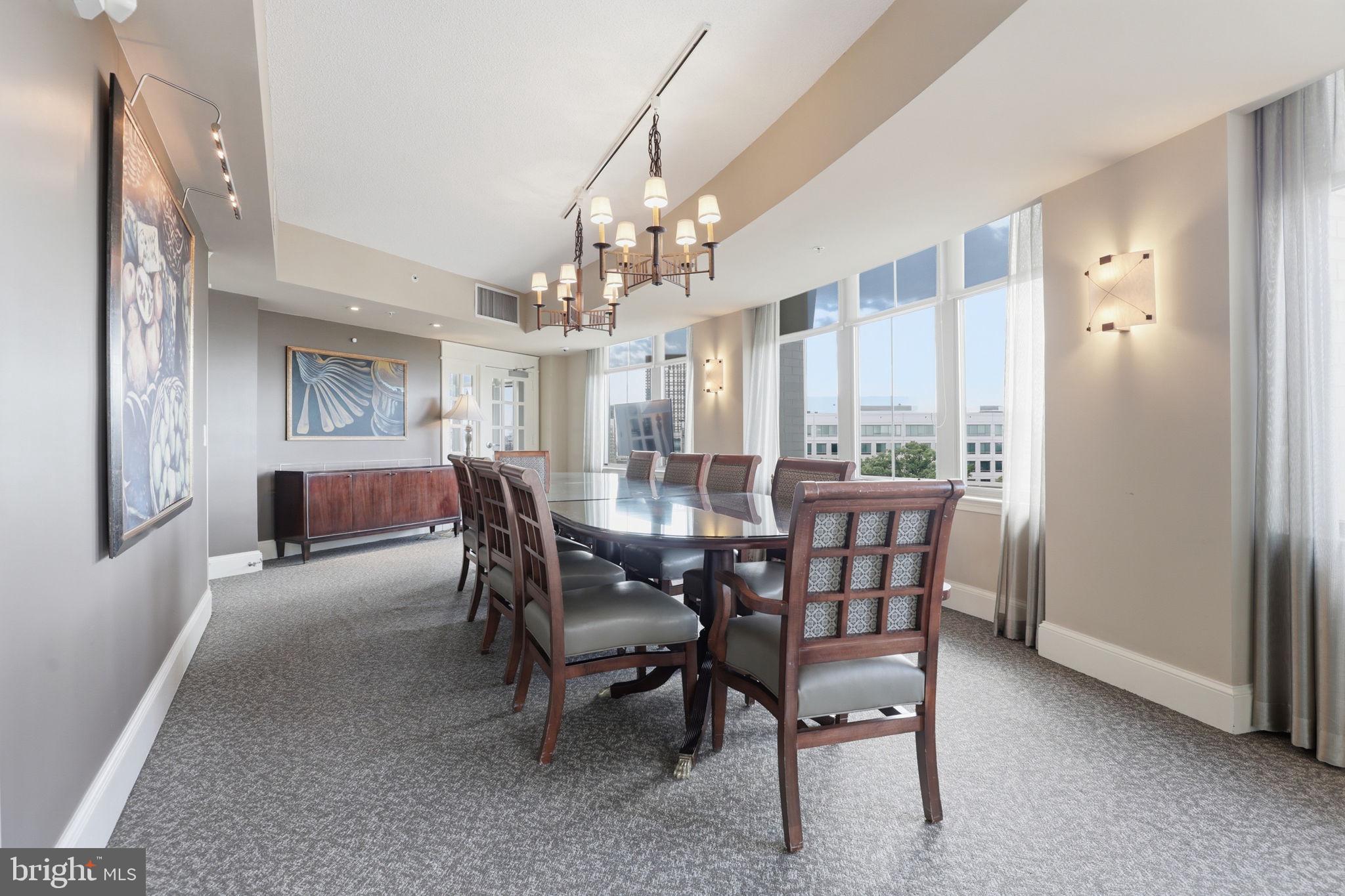 11800 Sunset Hills Road, Unit 218 Reston, VA 20190 - Photo 31 of 38 a view of a dining room with furniture and a chandelier