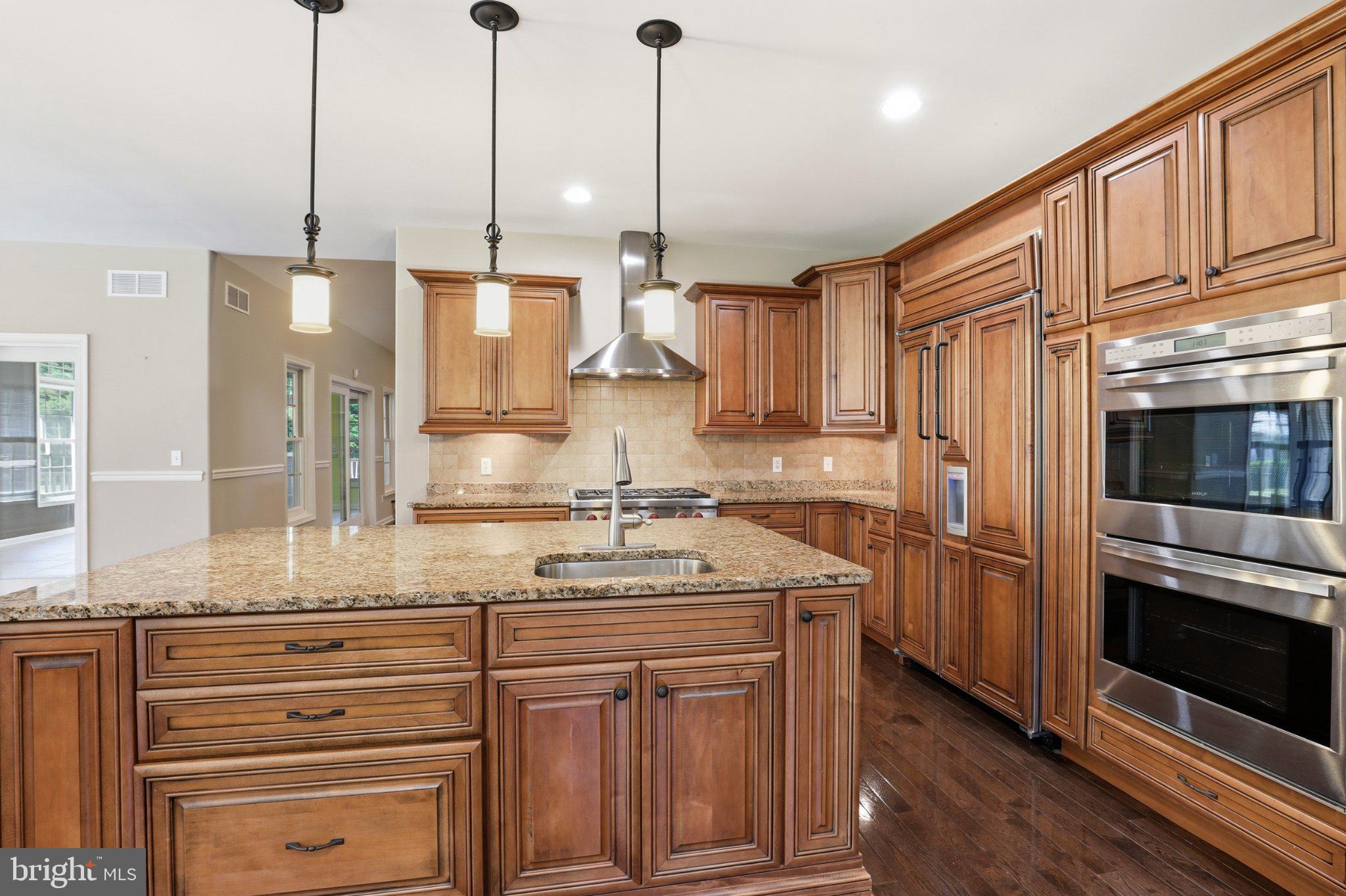 16932 Fitzgeralds Road Lincoln, DE 19960 - Photo 58 of 103 Elegant kitchen with rich wood tones.