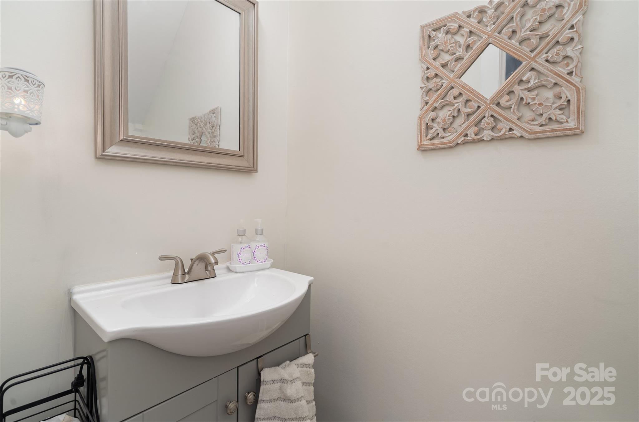 1052 McLain Road Kannapolis, NC 28083 - Photo 15 of 30 a bathroom with a sink and a mirror