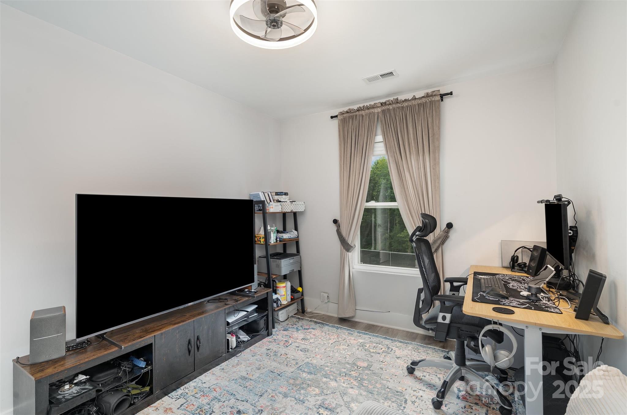 1052 McLain Road Kannapolis, NC 28083 - Photo 17 of 30 a living room with furniture and a flat screen tv