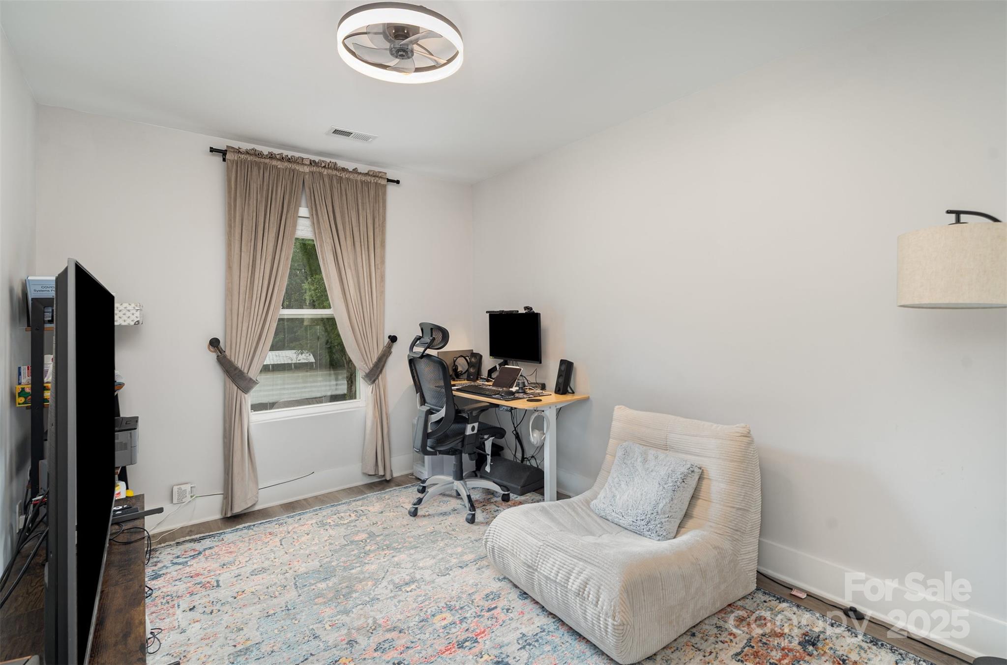 1052 McLain Road Kannapolis, NC 28083 - Photo 18 of 30 a living room with furniture and a flat screen tv