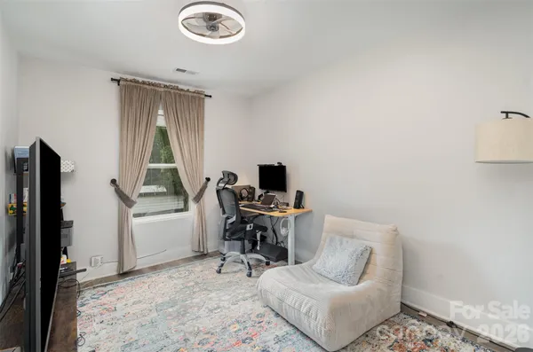 a spacious bathroom with a double vanity sink a mirror and a