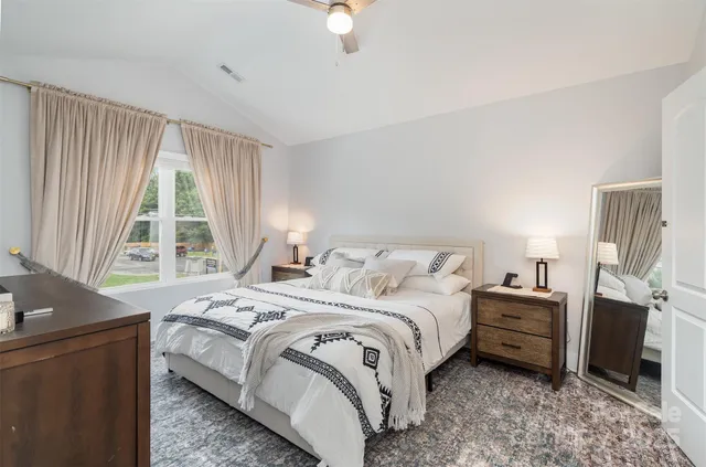 a bedroom with a bed and a couch