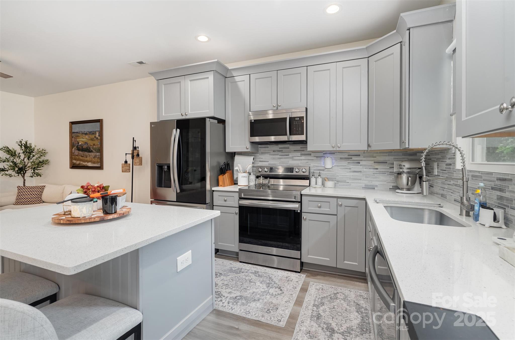1052 McLain Road Kannapolis, NC 28083 - Photo 2 of 30 a kitchen with a sink a stove and refrigerator