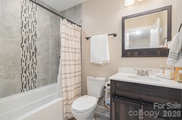 a view of a house with a yard and lawn chairs