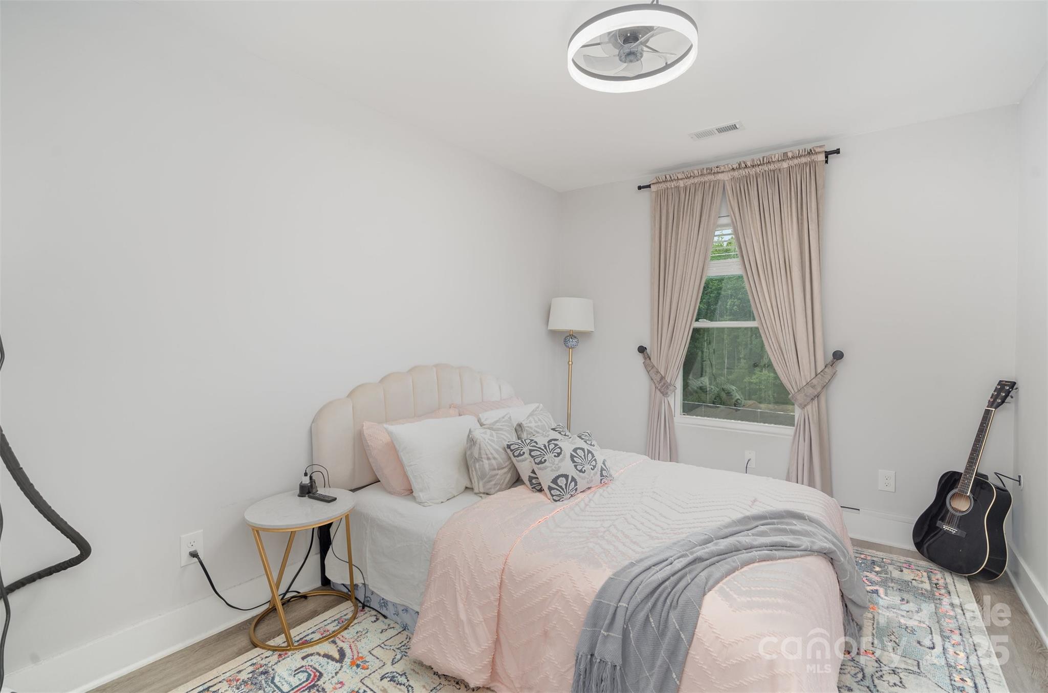 1052 McLain Road Kannapolis, NC 28083 - Photo 26 of 30 a bedroom with a bed and a window