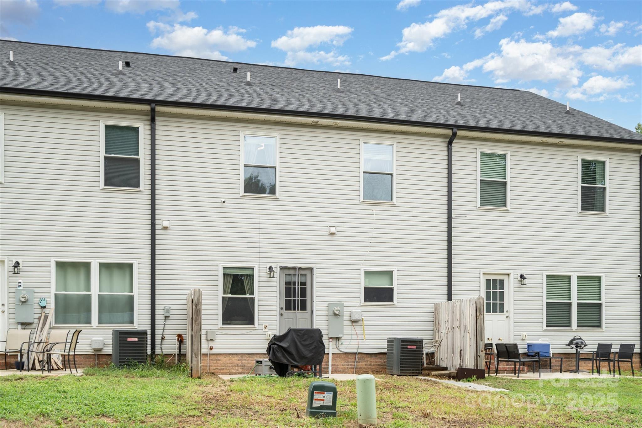1052 McLain Road Kannapolis, NC 28083 - Photo 30 of 30 a view of a house with swimming pool and a chairs in patio