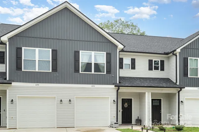 a front view of a house with garage