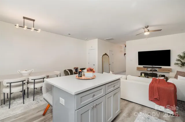 a view of living room with furniture and flat screen tv