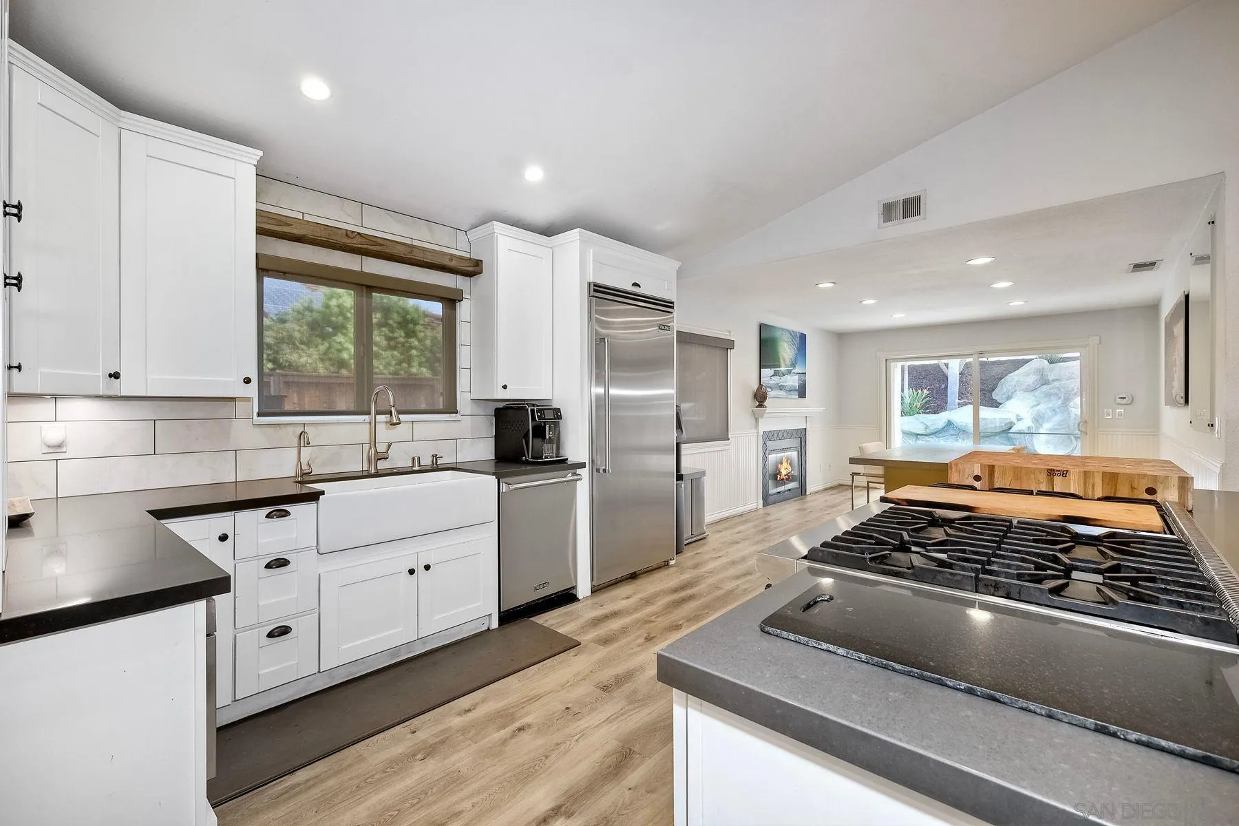 3511 Sitio Baya Carlsbad, CA 92009 - Photo 11 of 42 a kitchen with stainless steel appliances granite countertop a stove and a refrigerator