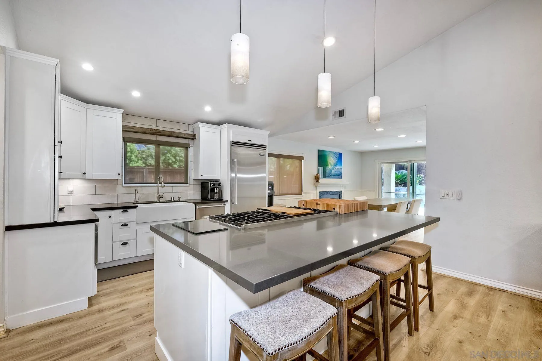3511 Sitio Baya Carlsbad, CA 92009 - Photo 12 of 42 a kitchen with stainless steel appliances granite countertop a stove a sink and a refrigerator