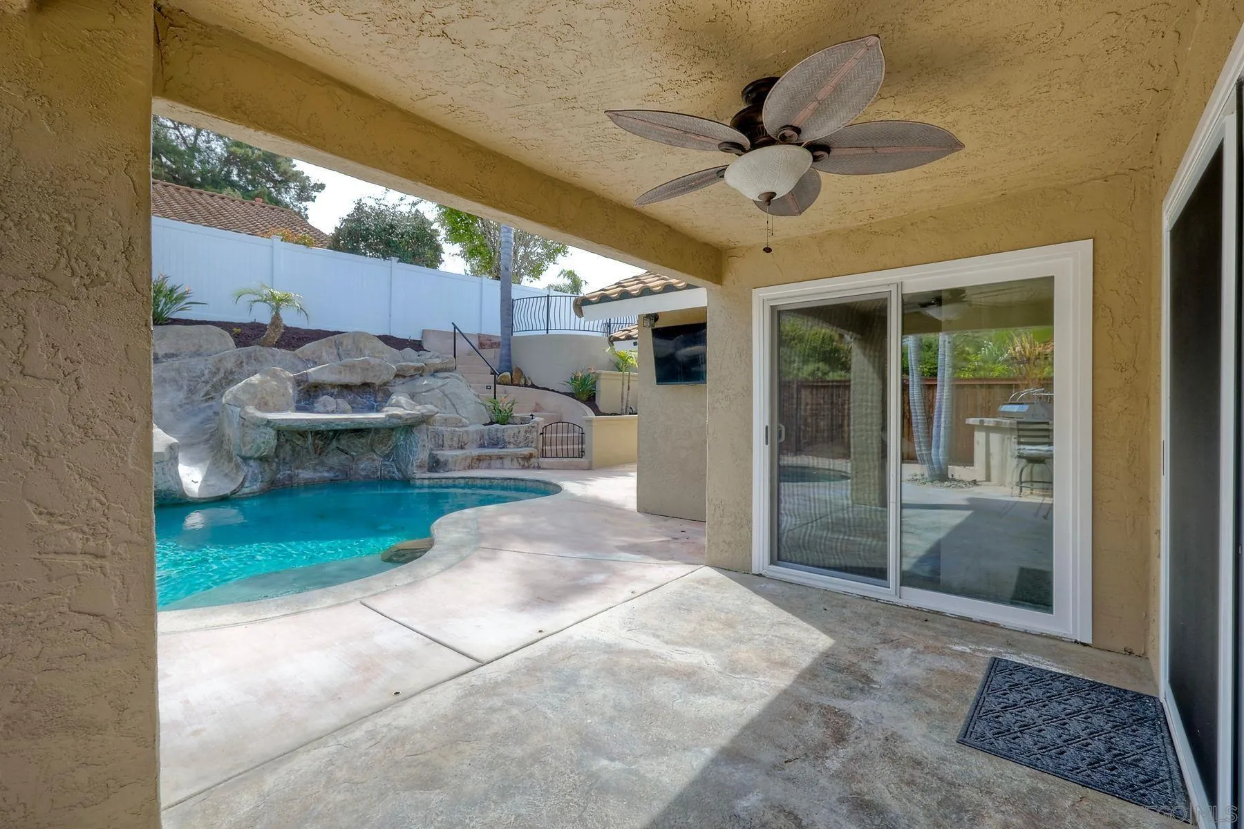 3511 Sitio Baya Carlsbad, CA 92009 - Photo 24 of 42 a view of a patio with a table and chairs