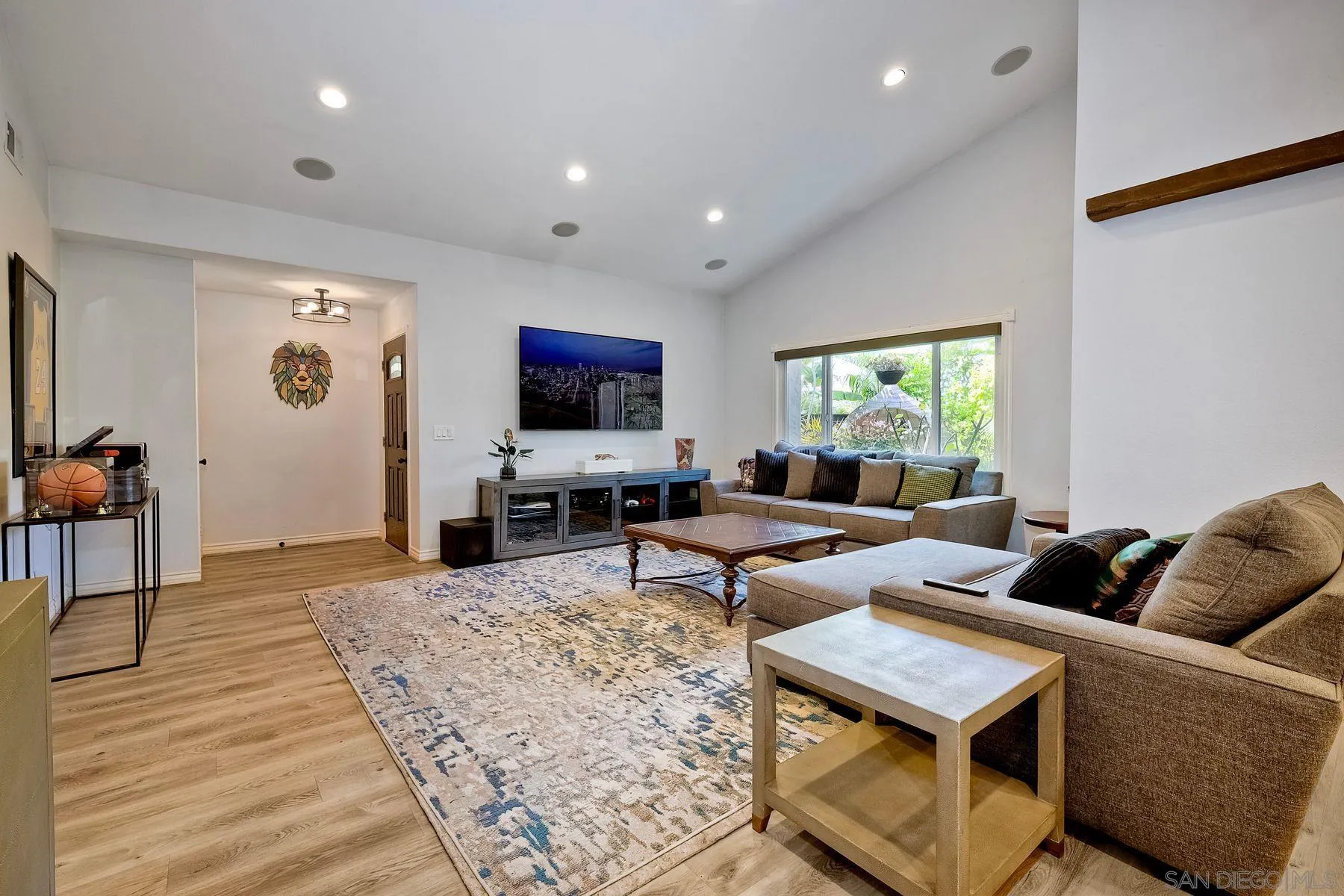 3511 Sitio Baya Carlsbad, CA 92009 - Photo 3 of 42 a living room with furniture and a flat screen tv