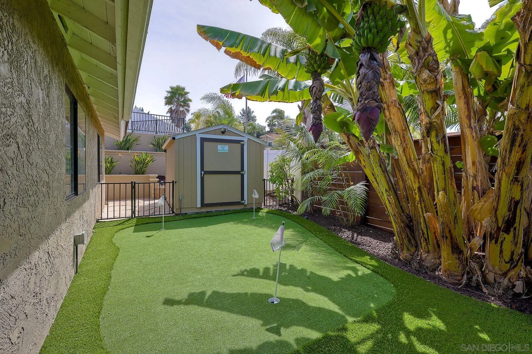 3511 Sitio Baya Carlsbad, CA 92009 - Photo 34 of 42 a backyard of a house with table and chairs