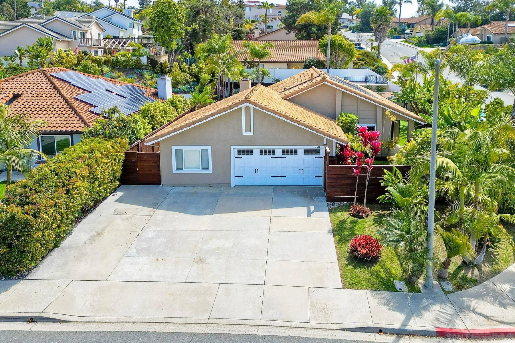 3511 Sitio Baya Carlsbad, CA 92009 - Photo 35 of 42 a front view of house with yard