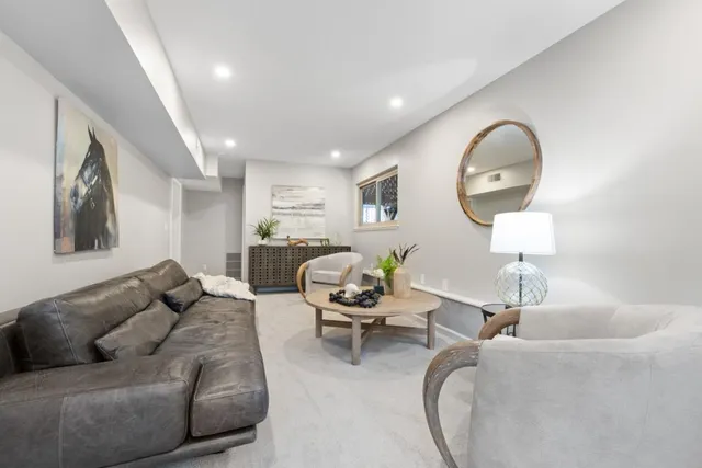 a bathroom with a shower sink and mirror