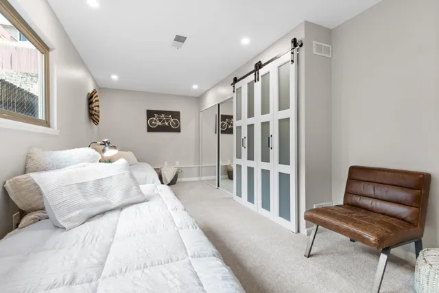 an aerial view of residential house and sandy dunes