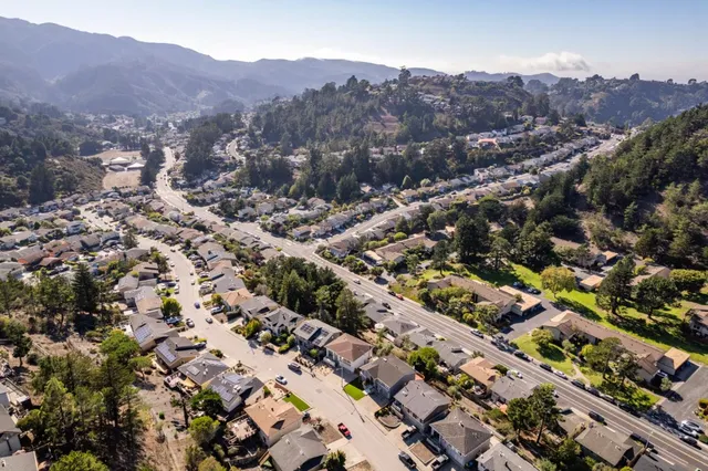 an aerial view of a house with outdoor space