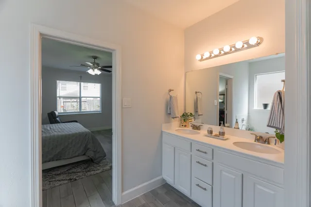 a en suite bathroom with a sink and a mirror