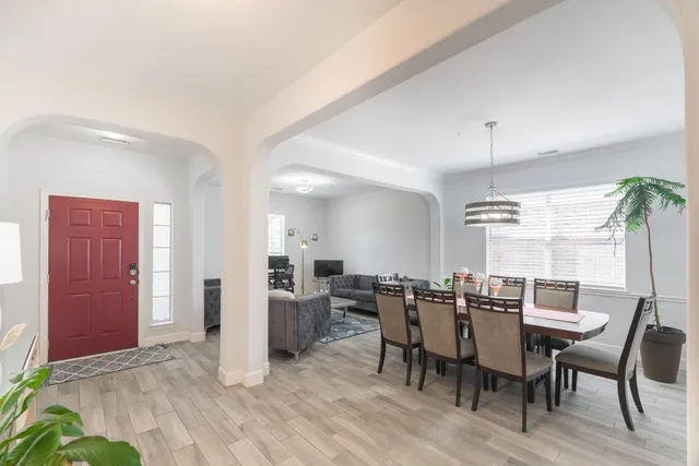 a view of a dining room with furniture and window