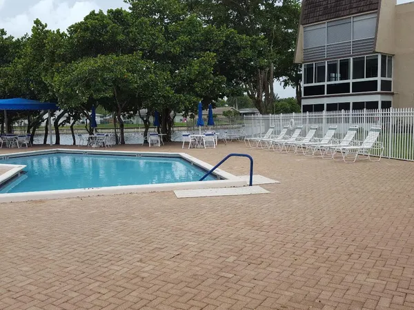 a view of a swimming pool with a patio