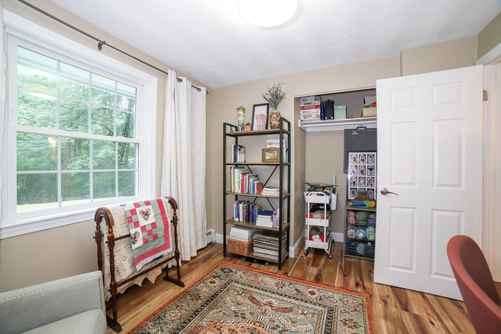 142 Mill Road Chelmsford, MA 01824 - Photo 18 of 34 a bedroom with furniture and a window