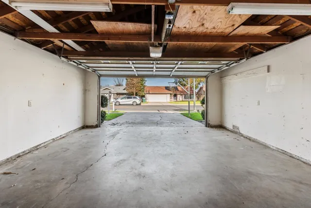 a view of empty room with wooden ceiling
