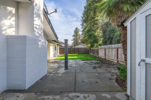 a view of a pathway with a backyard