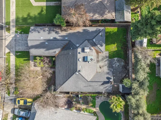 an aerial view of a house with outdoor space