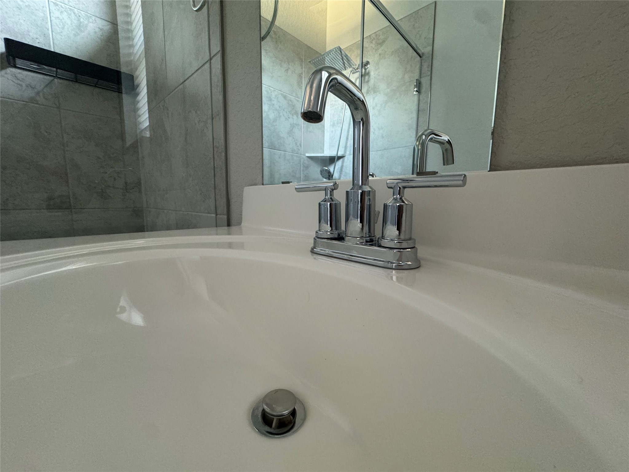9015 Cattle Baron Path, Unit 2004 Austin, TX 78747 - Photo 21 of 27 Pristine, clean chrome fixtures with a walk-in shower in one and a bathtub in the second bathroom - both on the second floor with washer and dryer included