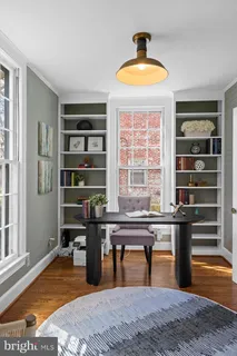 a view of entryway with wooden floor and stairs