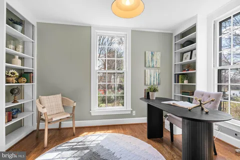 a bathroom with a sink toilet and a mirror