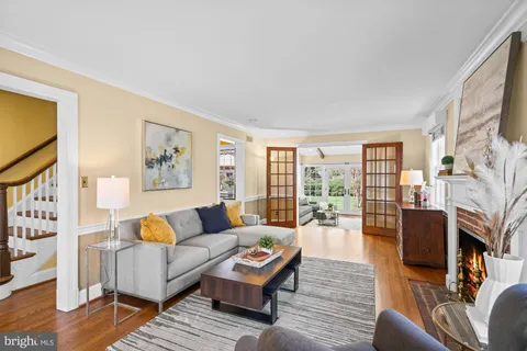 a view of a room with wooden floor and windows